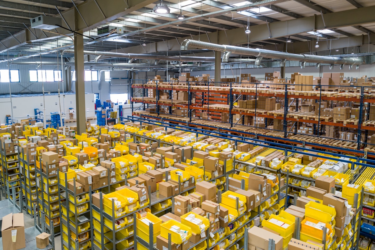 Warehouse worker wearing full PPE including safety boots